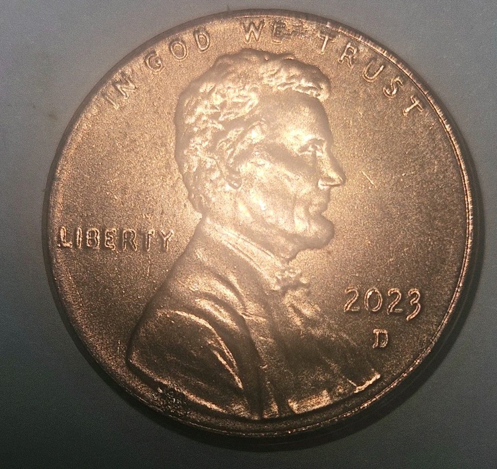 Close-up of 2023 penny DDO error showing doubling on LIBERTY and IN GOD WE TRUST lettering