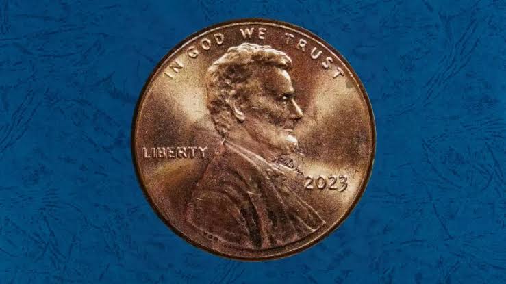 2023 penny off-center strike error showing design shifted with blank crescent of metal on one side