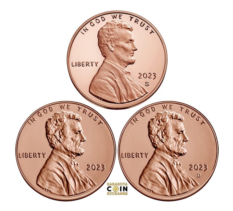Grading strip showing four 2023 pennies from worn circulated through gem uncirculated condition